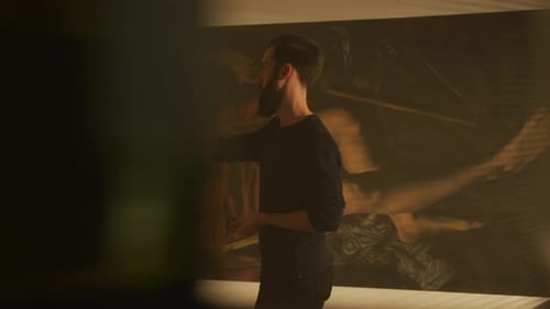 Artist Standing in Studio with Painting