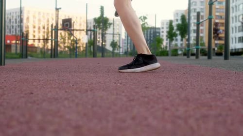 Slender Young Brunette in Black Sweater in Morning Makes Run on Spot