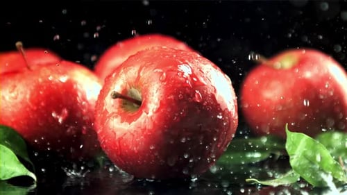 Red Apples with Water Droplets on Black Background