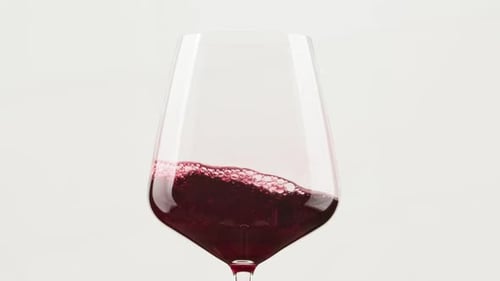 Red Wine Pouring Into Glass, Close Up