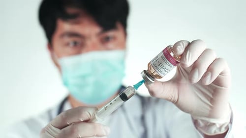Doctor Preparing Covid-19 Vaccine Injection in Hospital