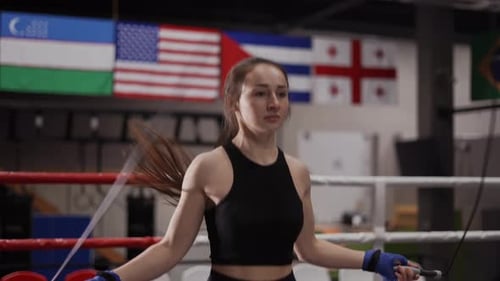 Woman Athlete Jumping Rope in Boxing Ring
