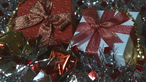 Festive Christmas Presents with Glittering Bows and Tinsel