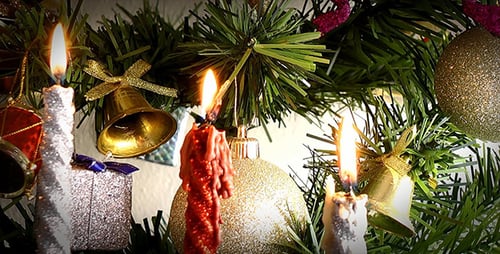 Glowing Candles and Ornaments on Christmas Tree