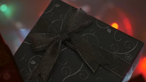 Close Up of a Black Gift With Bow