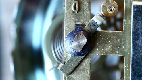 Clockwork Gears and Cogs Turning in Extreme Close Up