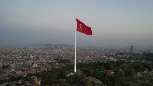Aerial View of Cityscape with a Large Flag