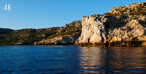 Coastal Cliffs Meet Calm Blue Ocean Water