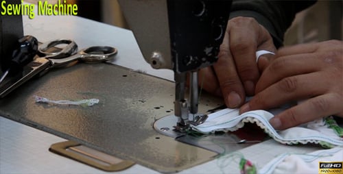 Hands Sewing Fabric With Sewing Machine, Close Up