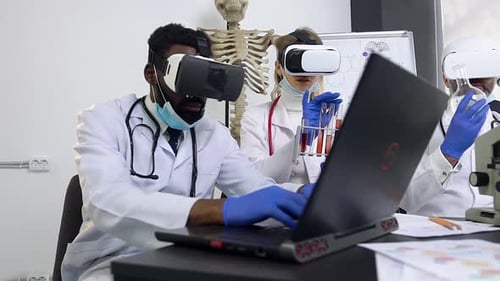 Scientists in VR Headsets Working in Lab