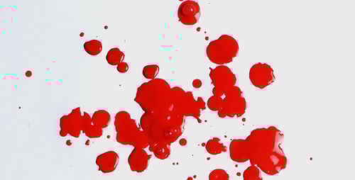 Vibrant Red Liquid Splatter on White Background