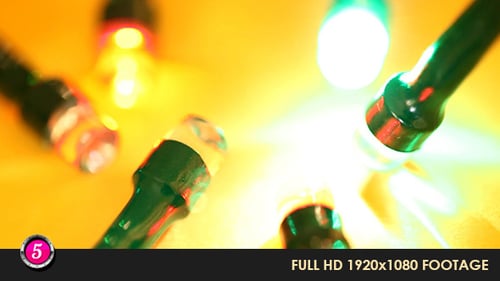 Close Up of Colorful Fairy Lights on Yellow