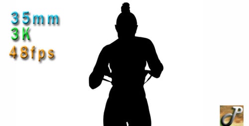 Silhouette of Young Woman Stretching in Exercise Gear