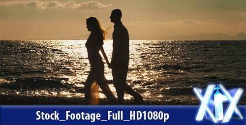 Couple Walking On The Beach