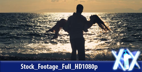 Romantic Couple Embracing Silhouetted on a Beach at Sunset