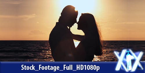 Couple Silhouette Kissing on Beach at Sunset