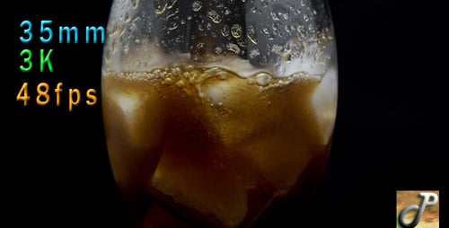 Amber Liquid Poured Over Ice in Tall Glass