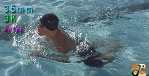 Man Swimming Laps in Bright Sunny Pool