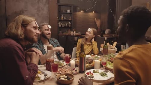 Friends Gather for Dinner Party Game at Home