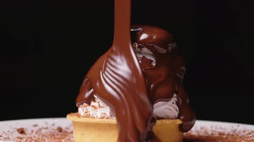 Melted Chocolate Being Poured Over Dessert Close Up