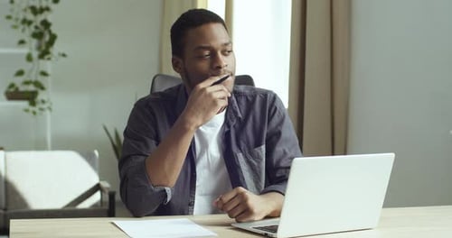Man Working at Desk with Computer