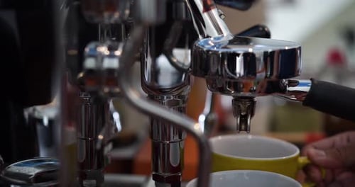 Footage B Roll of Pouring coffee stream from machine in cup. Home making hot Espresso. Using filter