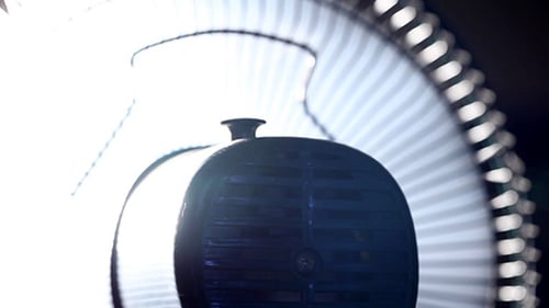 Air Conditioning Fan Rotating Blades in Bright Light