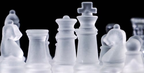 Crystal Chess Pieces in a Somber Dark Setting