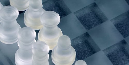 Glass Chess Pieces on Frosted Board