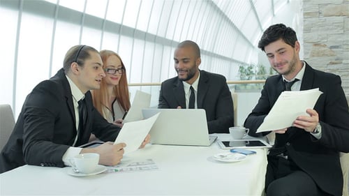 Team Meeting in Modern Workplace with Technology