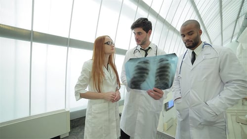 Medical Professionals Analyzing a Chest X-Ray