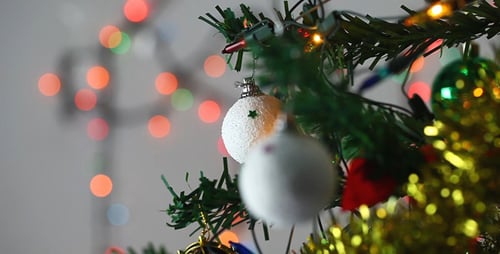 Christmas Tree Ornament with Sparkling Lights Background