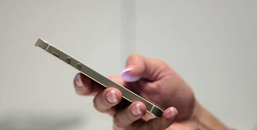 Woman Using Golden Smart Phone