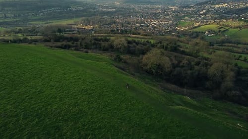 Dusk Dawn Aerial Drone Countryside Runner With Dog Sunrise Sunset Hilltop View 3