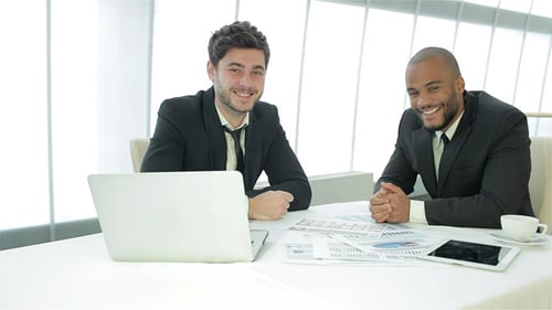 Business Meeting: Young Men Discussing Data and Documents
