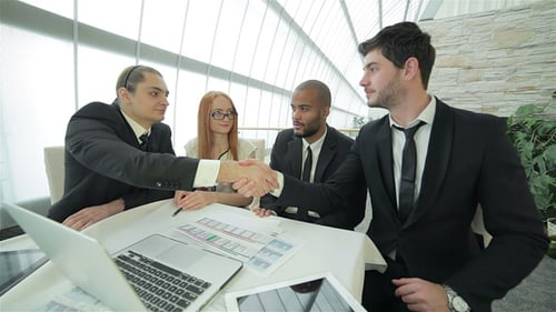 Business Meeting with Tech and Paper Data