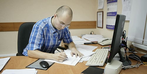 Office Worker Works With Diagrams