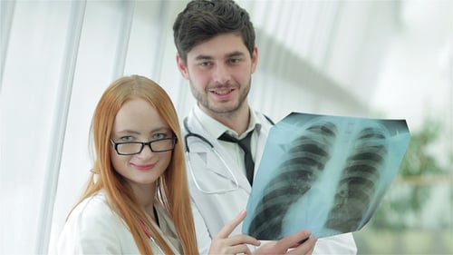Doctors Examining X-Ray in Hospital Setting