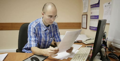Office Worker Reads Documents