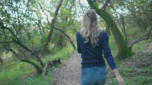 Girl Hiking In The Forest