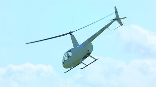 Helicopter Flying in the Sky on a Sunny Day