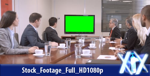 Corporate Team Attends Meeting at Boardroom Table