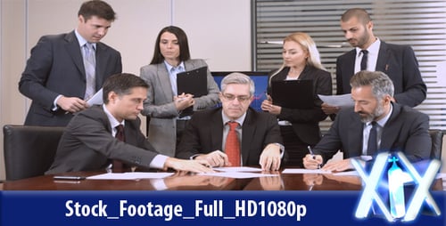 Professionals Signing Contracts at a Conference Table