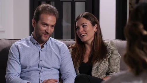 Happy Couple Conversing During Counseling Session Indoors