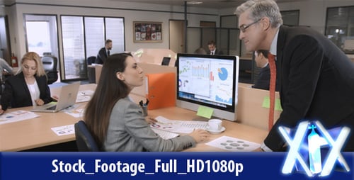 Professionals Working at Desks in Modern Office