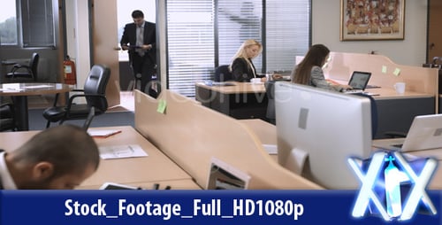 People Working at Computers in Modern Office