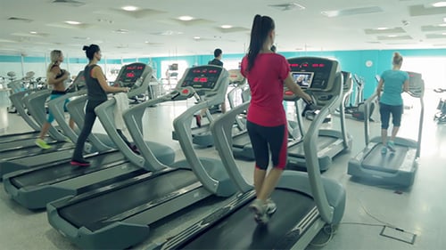 Running on Treadmill in the Fitness Club