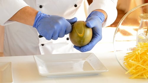 Chef Peels a Fresh Mango for Cooking
