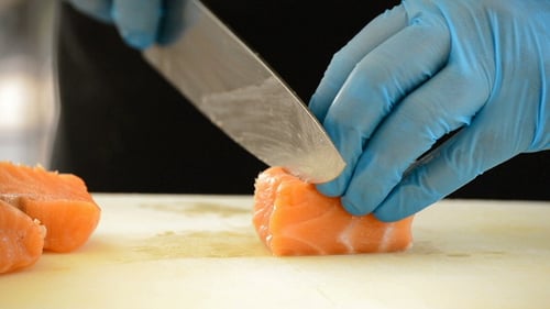 Cutting Fresh Salmon for Food Preparation