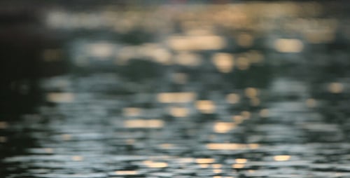 Blurred Water Reflecting Light at Sunrise